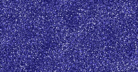 Bright blue background with white and black flecks that resemble the texture of marble chips.