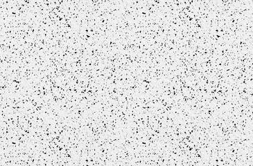 Textured white background with black flecks