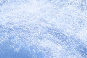 Fresh sparkling snow blue tone close-up, perfect as a winter season background texture