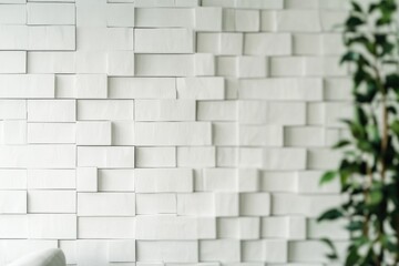 A simple scene of a white chair and a plant in a room