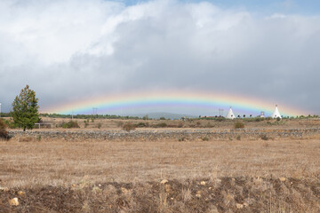 Big Rainbow in Santa Catalina de Somoza in the cloudy sky on the Camino de Santiago