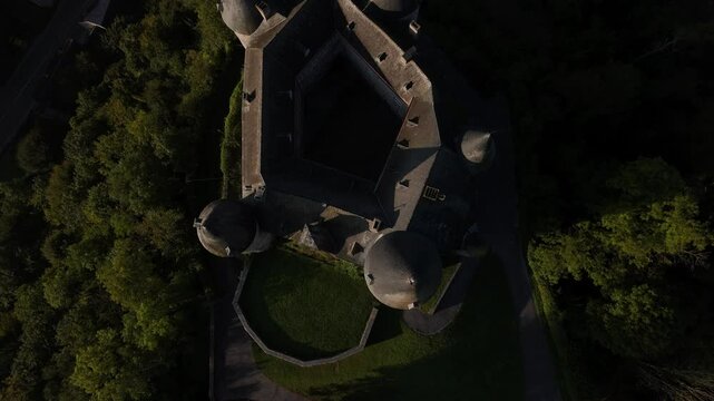 Exploring the enchanting Veves Castle from above in the serene countryside