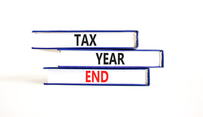 Tax year end symbol. Concept words Tax year end on beautiful blue white books. Beautiful white background. Business tax year end concept. Copy space.