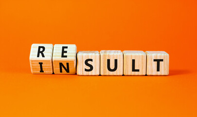 Result or insult symbol. Concept words Result Insult on wooden cubes. Beautiful orange table orange background. Business and result or insult concept. Copy space.