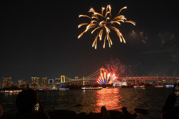December 21, 2024, Odaiba Fireworks show with Rainbow Bridge in the background, Japan. 