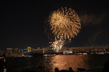 December 21, 2024, Odaiba Fireworks show with Rainbow Bridge in the background, Japan. 