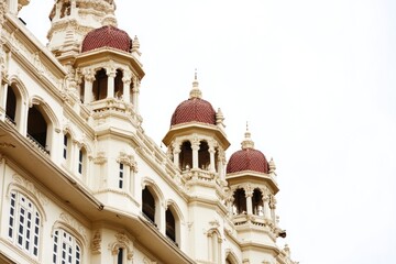 A large white building with a prominent clock tower on the front