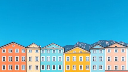 Colorful houses, mountain backdrop, sunny day, travel postcard