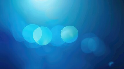 A blurred blue background with soft bokeh effects, creating a serene and abstract atmosphere.