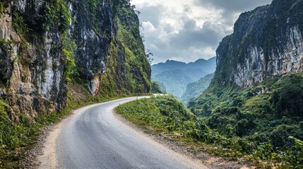 Naklejka premium Scenic Curved Road Adventure Mountain Region Landscape Photography Natural Environment Elevated Viewpoint Journey Concept