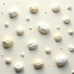 Round sea stones scattered on a serene white and beige abstract landscape, beige, nature