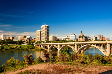 A city view with a bridge over a river