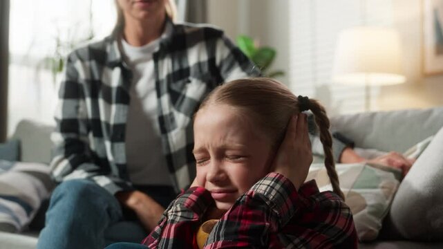 Caucasian angry woman female mom mother scolding shouting yelling rebellious little kid child girl daughter close ears not listening ignoring victim home violence family demand discipline quarrel