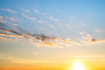 Sky,sunset, beautiful , luxury soft gradient orange gold clouds and sunlight on the blue sky perfect for the background, Sunrise on morning or everning in winter warm time ,Twilight summer,silhouette