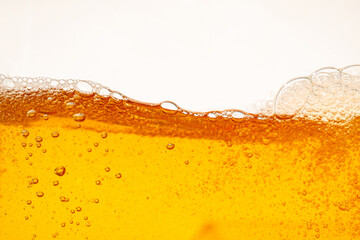 Close up bright orange Oil or beer splash texture and nature waves, Beautiful waves curve and...