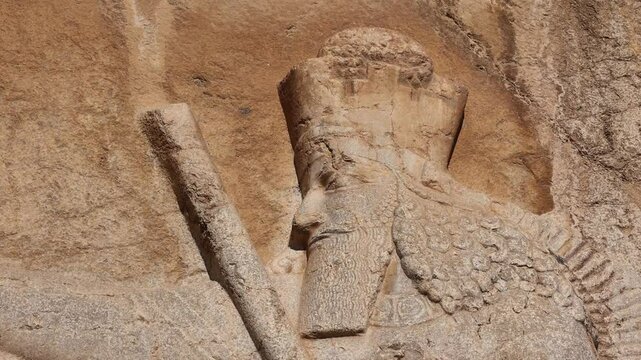 Naqsh-e Rostam necropolis of Persepolis in Fars Province with tomb of Darius I the Great, Iran. The tombs of the ancient Persian kings are decorated with bas-reliefs carved into the rocks