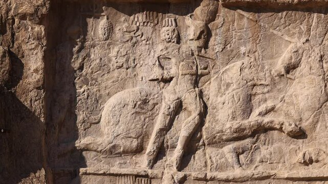 Naqsh-e Rostam necropolis of Persepolis in Fars Province with tomb of Darius I the Great, Iran. The tombs of the ancient Persian kings are decorated with bas-reliefs carved into the rocks