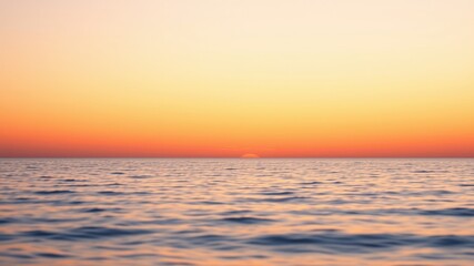 Obraz premium Serene Ocean Sunset A Calm Seascape at Twilight