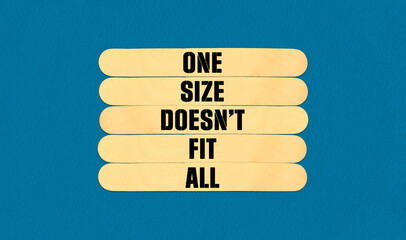One Size Does Not Fit All Symbol. Concept word One Size Does Not Fit All on beautiful wooden stick. Beautiful Blue Chart Paper Background. Business and One Size Does Not Fit All concept. Copy space