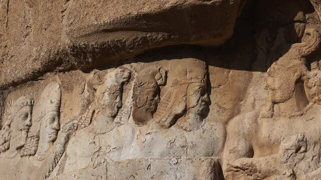 Naqsh-e Rostam necropolis of Persepolis in Fars Province with tomb of Darius I the Great, Iran. The tombs of the ancient Persian kings are decorated with bas-reliefs carved into the rocks
