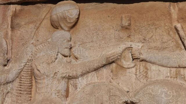 Naqsh-e Rostam necropolis of Persepolis in Fars Province with tomb of Darius I the Great, Iran. The tombs of the ancient Persian kings are decorated with bas-reliefs carved into the rocks