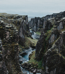 Majestic Fjaðrárgljúfur canyon with a winding river, South Iceland landscape.