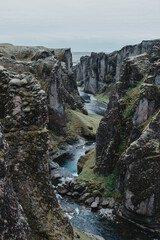 Majestic Fjaðrárgljúfur canyon with a winding river, South Iceland landscape.