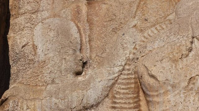Naqsh-e Rostam necropolis of Persepolis in Fars Province with tomb of Darius I the Great, Iran. The tombs of the ancient Persian kings are decorated with bas-reliefs carved into the rocks