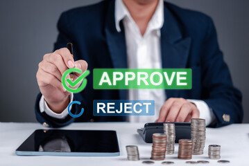 Businessman checking mark Approve and Reject with coins and a calculator on the table. finance banking, investment, loans, or business processes. analysis and transactions.
