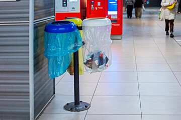 containers for sorting garbage in the subway. Environmental protection. Waste recycling