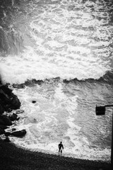 Fototapeta premium silhouette of a man walking on the beach