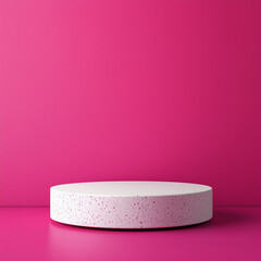 Pink background with a speckled white podium for vibrant product presentation