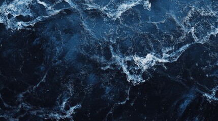 Obraz premium Dark blue ocean water texture with white foam.