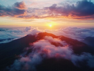 Fototapeta premium Sunset over mountain with clouds