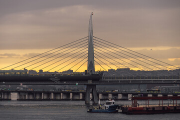 Sunset view of Halic Metro Bridge and cityscape of Istanbul with cloudy sky. Istanbul Turkiye