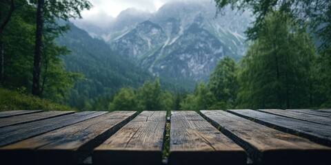 Fototapeta premium Mountain landscape with wooden table
