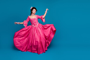 Full length photo of happy sweet lady dressed baroque costume dancing copy space isolated blue...