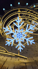 Beautiful glowing Christmas and New year decorations with big abstract snowflakes