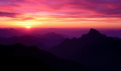 Vibrant sunset paints the sky with purple hues and an orange glow, silhouetting mountains in a panoramic, ethereal landscape. A breathtaking twilight scene of nature's serene beauty.