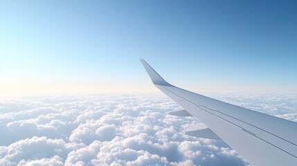 Obraz premium Modern airplane wing view in clear sky, calm aerial travel experience with cloudscape horizon, professional visual showing modern airplane wing view across clean airspace
