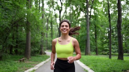 Young woman jogging in a park	 - Powered by Adobe