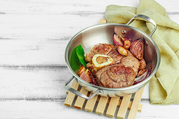 Ossobuco beef meat with spices and fresh herbs. Veal shank steak, traditional Italian ingredient