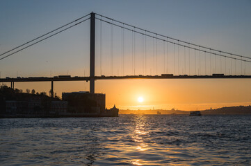 Beautiful view of the Bosphorus and the Bosphorus Bridge in the background at sunset.