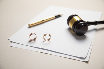 Judge gavel, documents and wedding rings. Divorce
