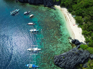 Aerial view of an amazing beach in El Nido, Philippines, with traditional boats. High quality photo