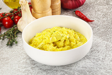Italian cuisine - yellow risotto with chicken