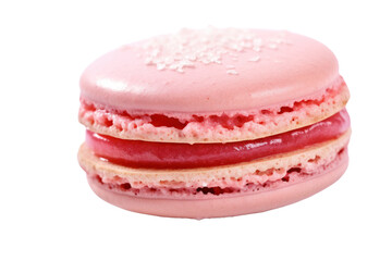 A beautifully crafted pink French macaroon rests in the center, featuring a soft, chewy texture and a subtle sheen. The filling, made from organic strawberry jam