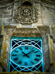 Vintage Clock on a Historic Stone Building