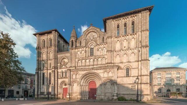 Eglise Abbatiale Sainte-Croix timelapse hyperlapse in Bordeaux, France, Romanesque Catholic church with a medieval facade. Landmark showcases rich architectural and cultural heritage under a blue sky