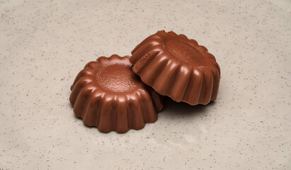 Chocolate mold treats on meutral background. Perfect for use in advertising chocolate products, gourmet treats, or dessert photography.